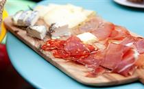 Charcuterie board of cold meats and cheeses